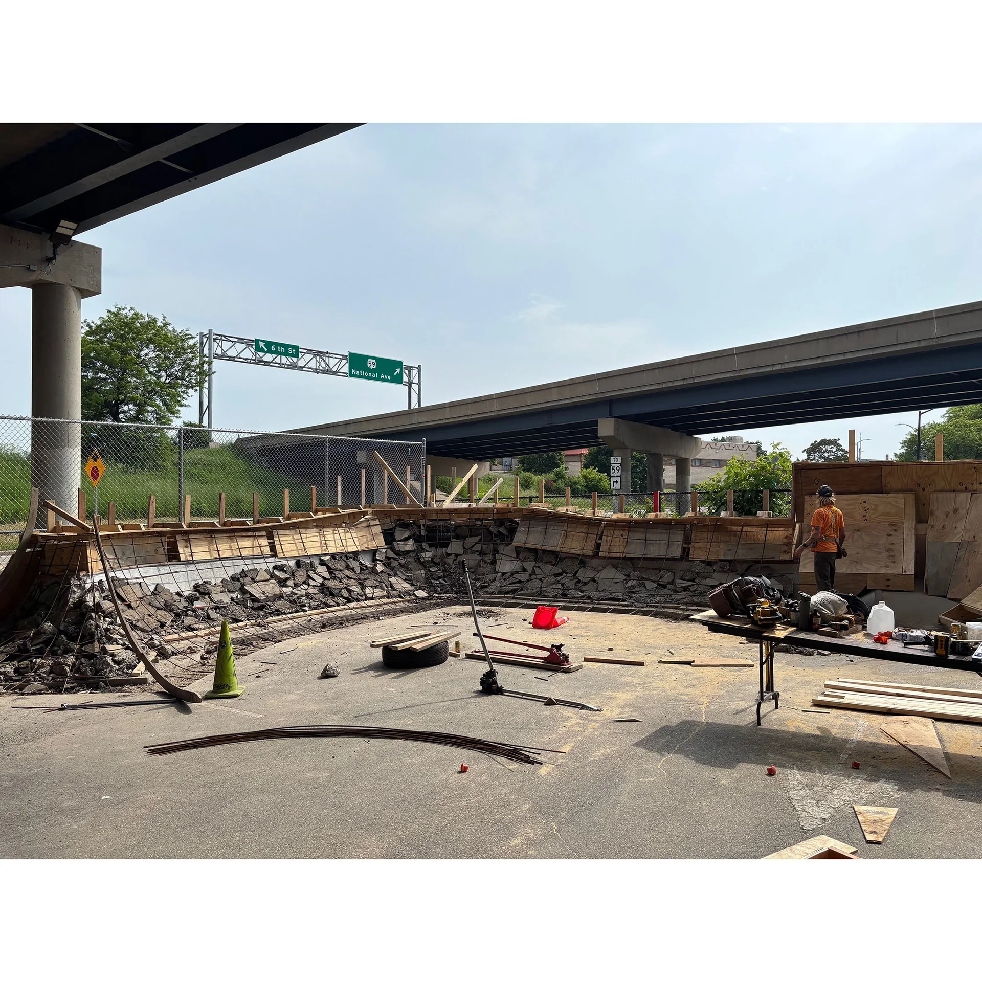 Wide photo showing a whole section of the skatepark framed in wood and rebar before pouring concrete.